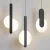Nordic-nocna-lampa-wisz-ca-d-uga-linia-luksusowa-czarna-minimalistyczna-ciana-lampa-wisz-ca-sypialnia.jpg_.webp